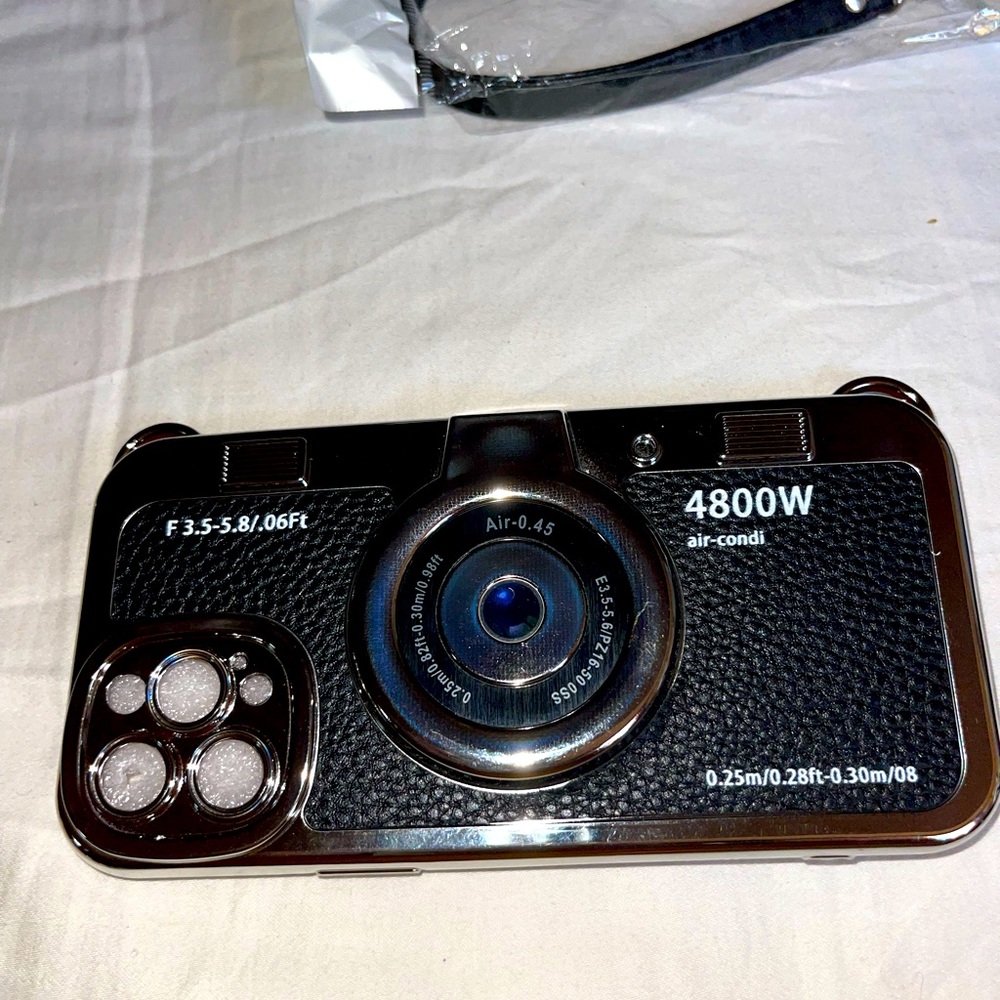 iPhone 12 promax phone case. Brand new. Never used. Has a strap included.